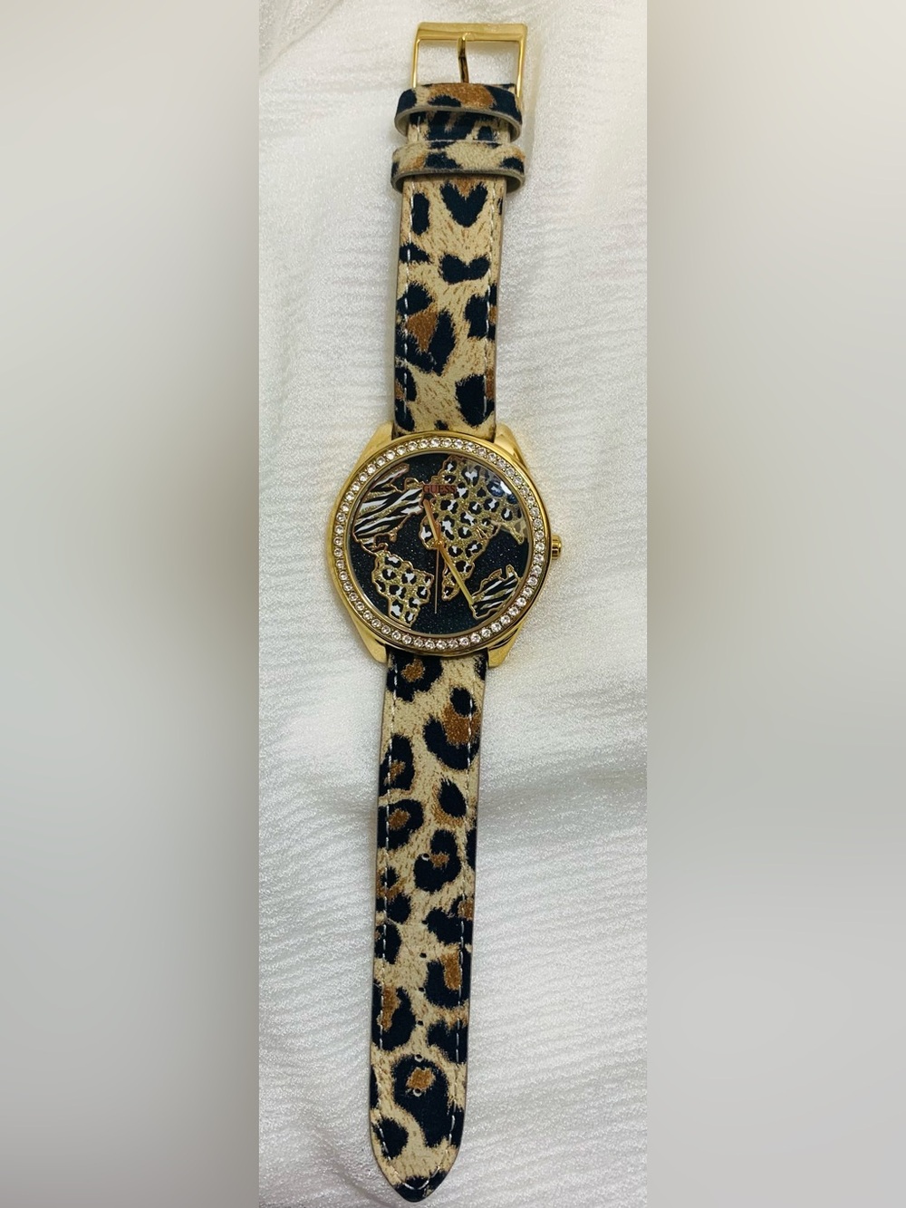Guess "World of Treasures" leopard print watch.